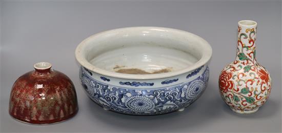 A Chinese blue and white large tripod censer, a peach bloom brush washer and a famille verte vase